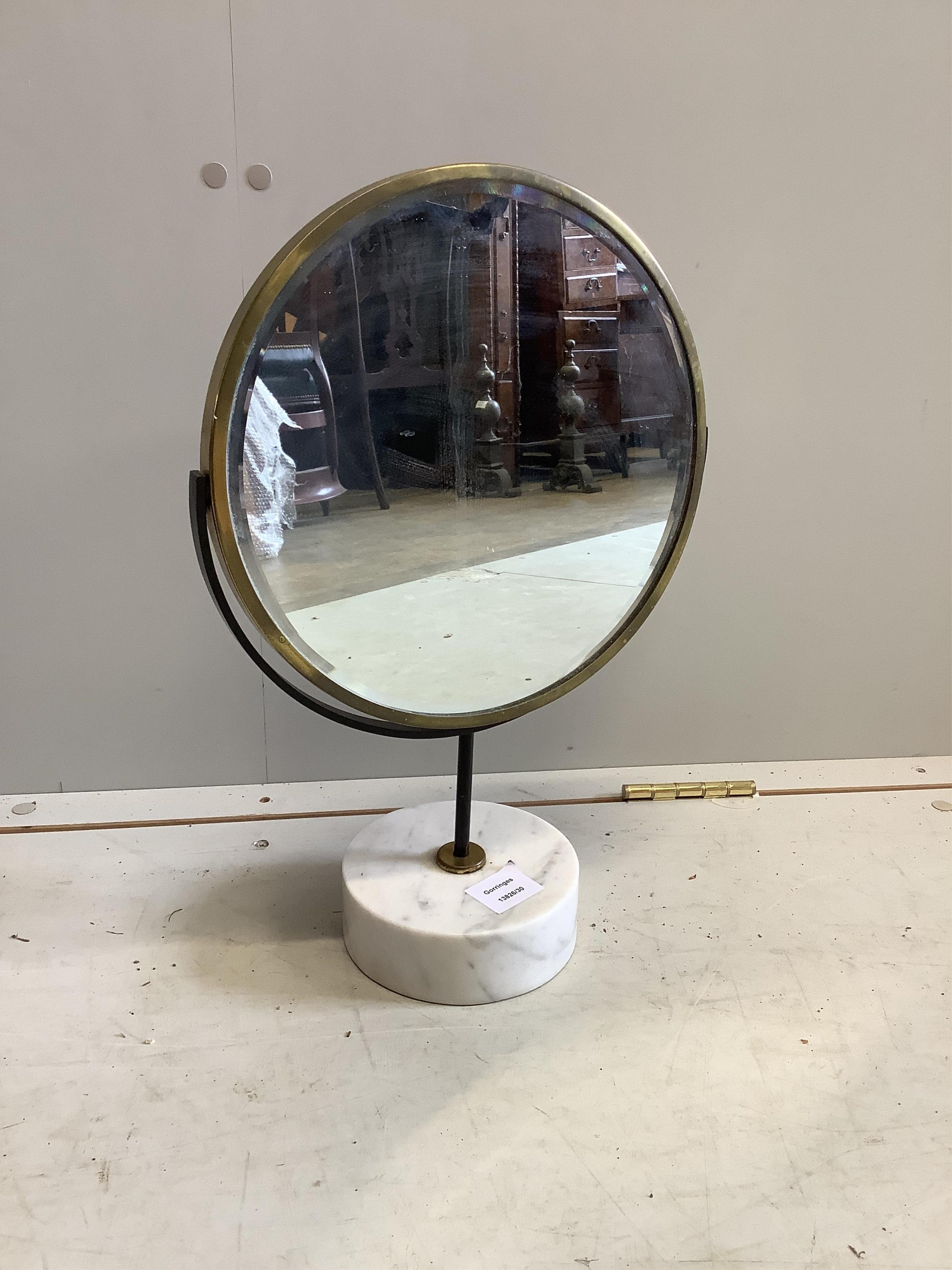 A mid century brass framed swivel toilet mirror, on circular marble base, height 48cm. Condition - fair